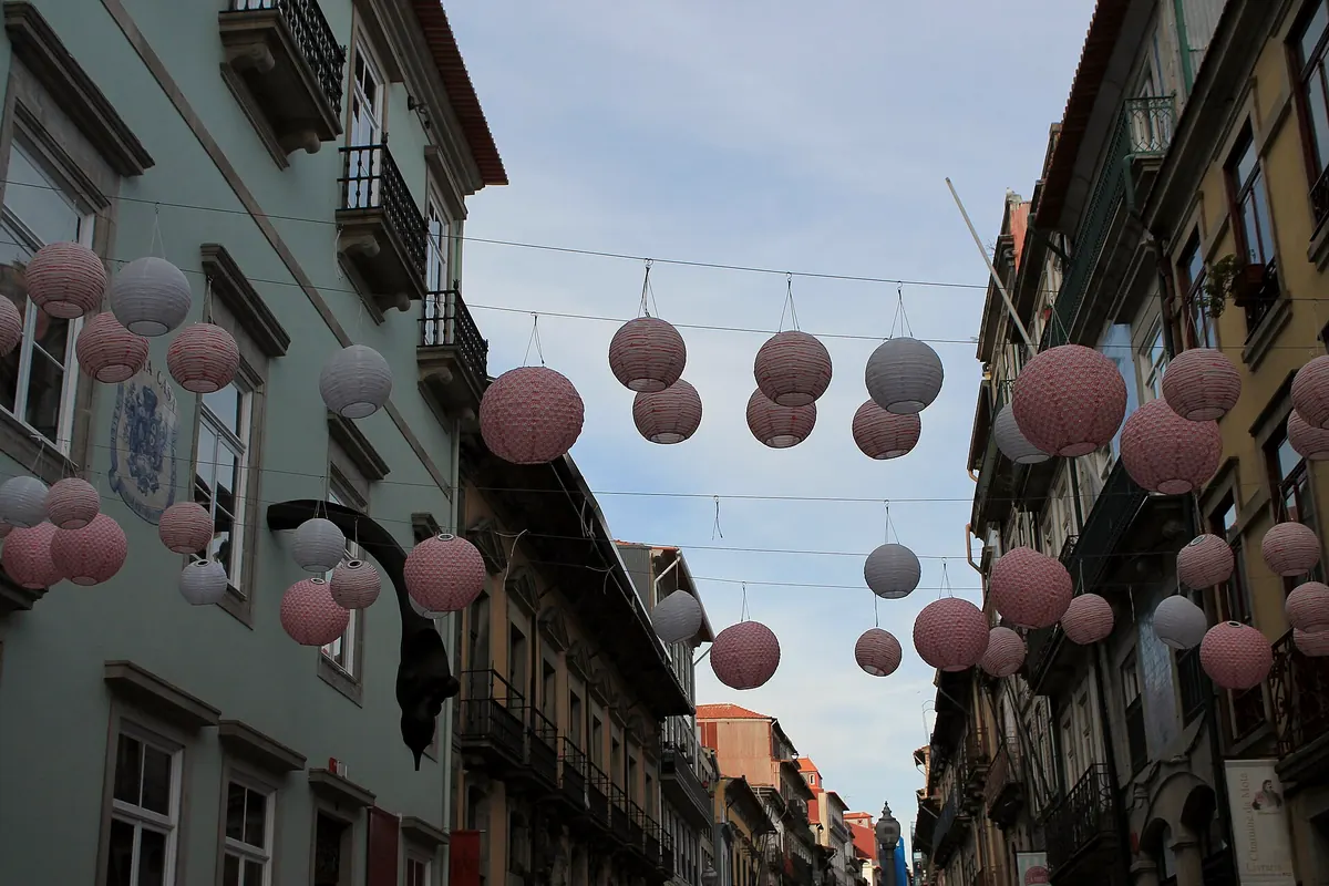Paper lanterns strung above Rua das Flores