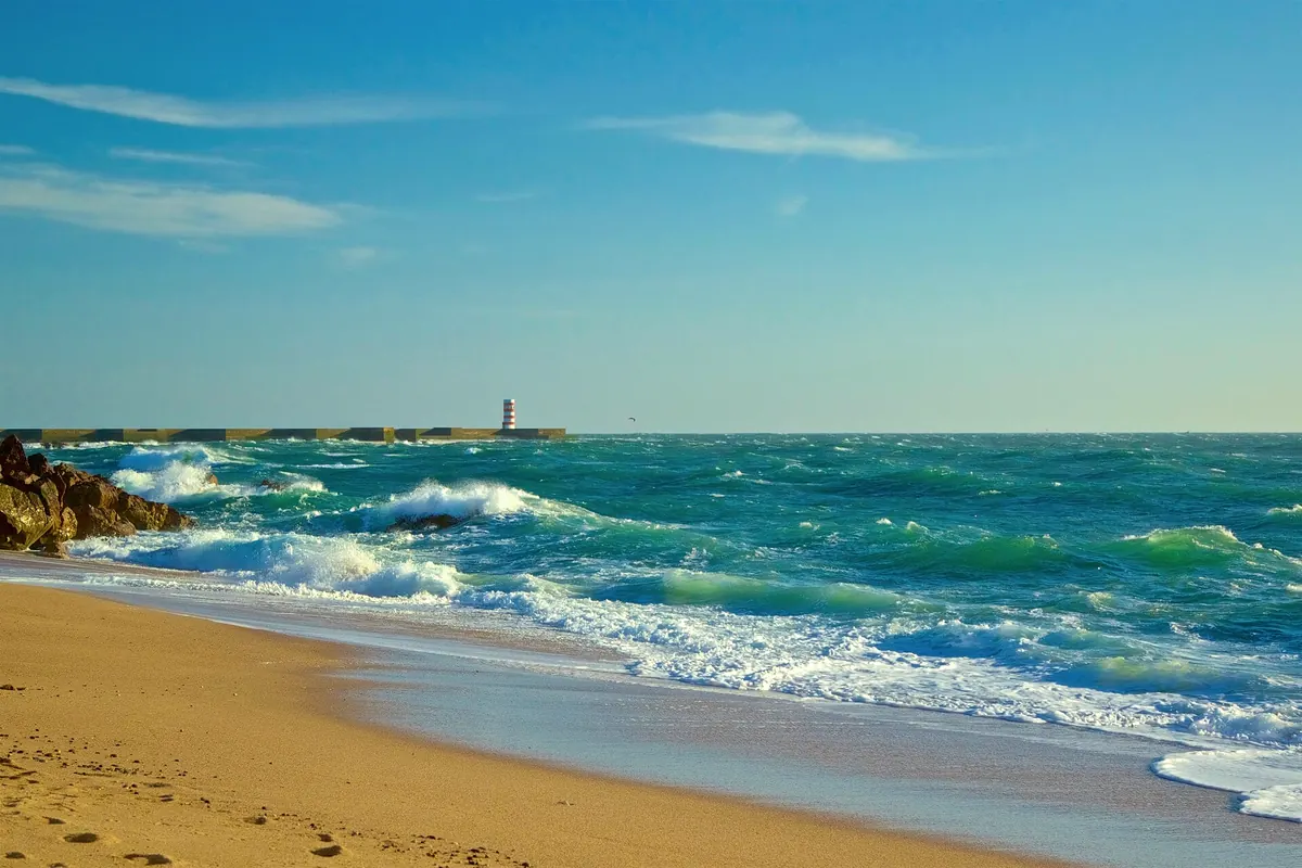 Atlantic waves on a sandy beach in Foz do Douro