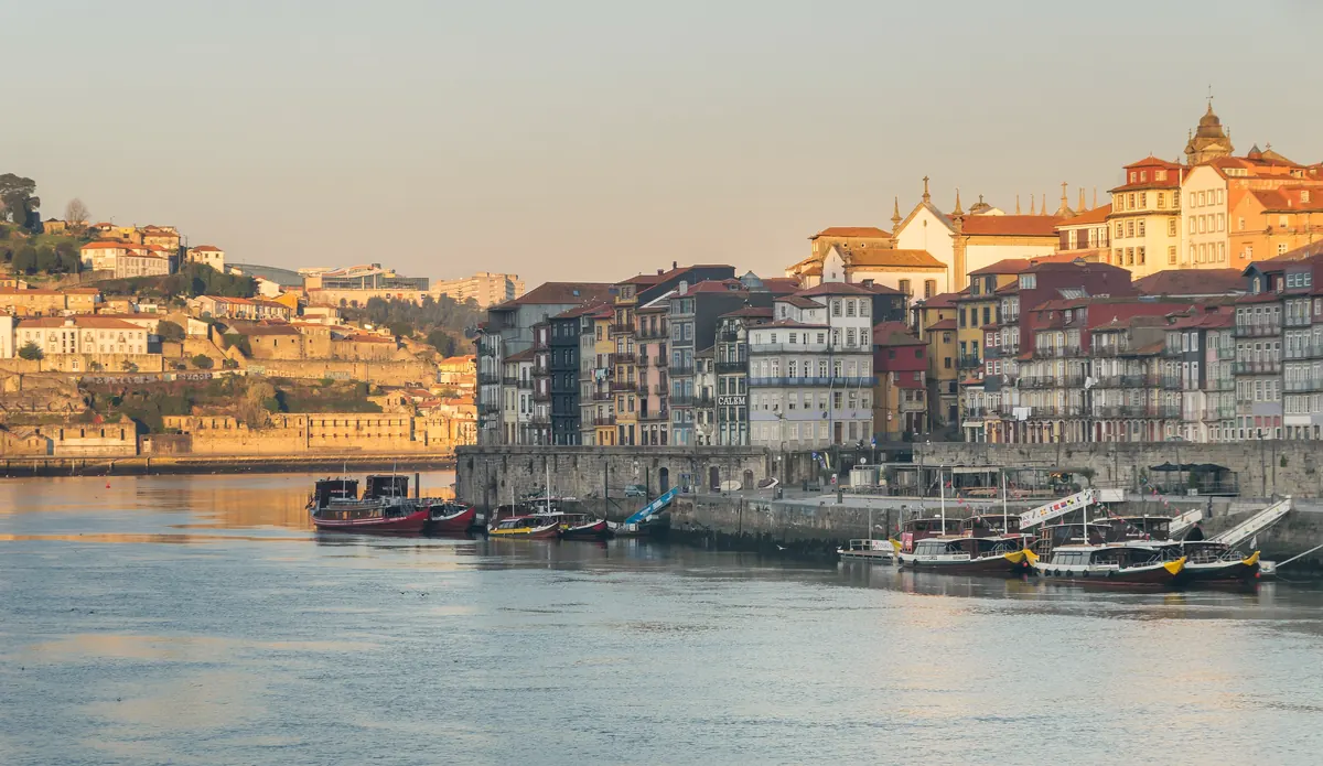 Cais da Ribeira's riverside houses glowing in late-afternoon light above the Douro